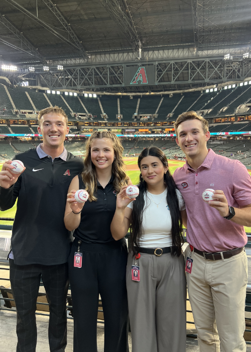 UNC student Jasmin Mazariegos posing with fellow interns in the Arizona Diamondbacks stadium
