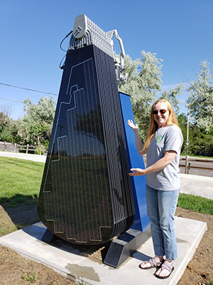 Marie Lee stands in front of the Solar Flower, which she led efforts for during her time at UNC.
