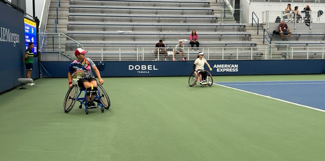 Sabina pushing her wheelchair at the US Open