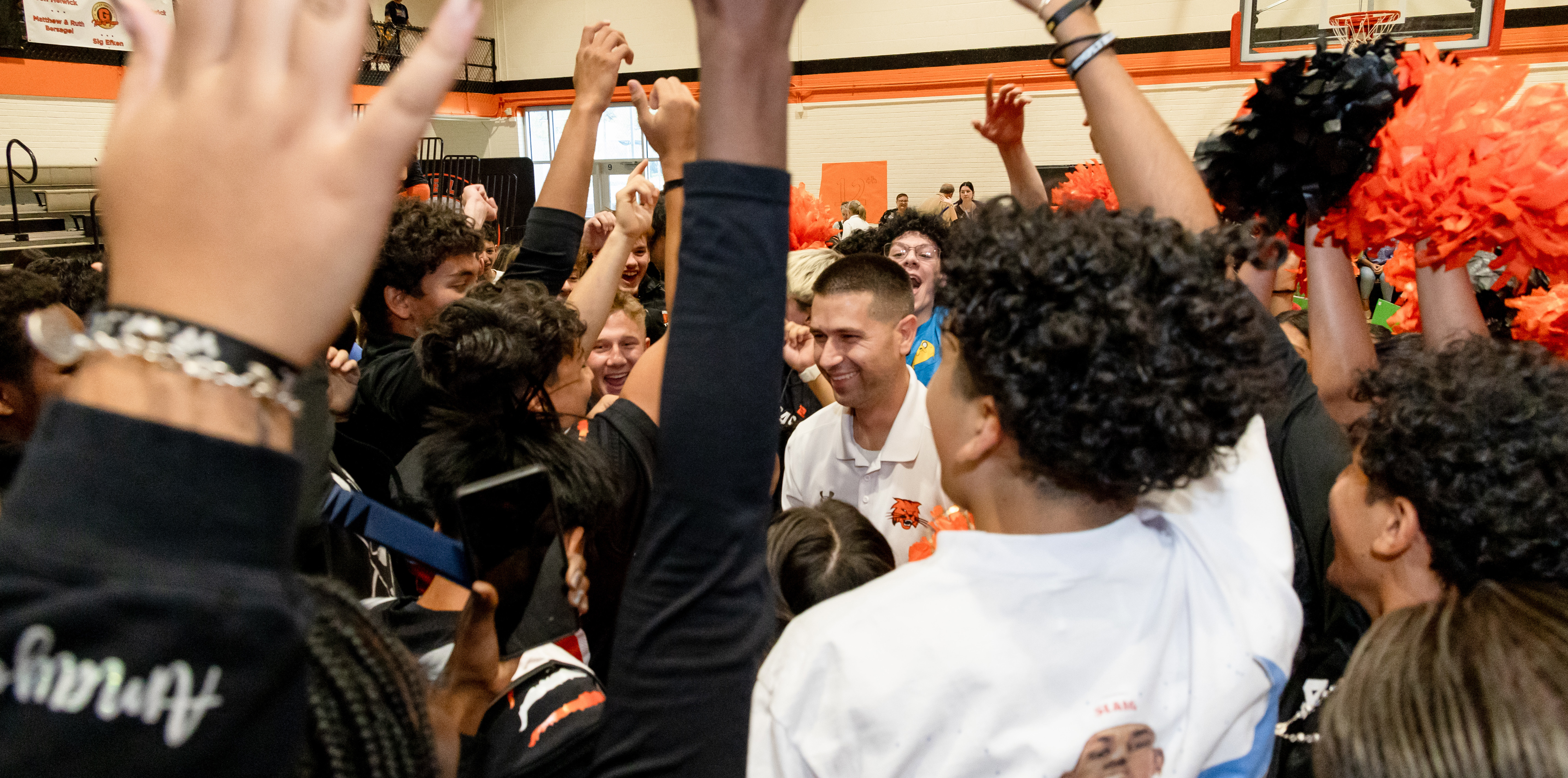 Stephen Paulson surrounded by people celebrating
