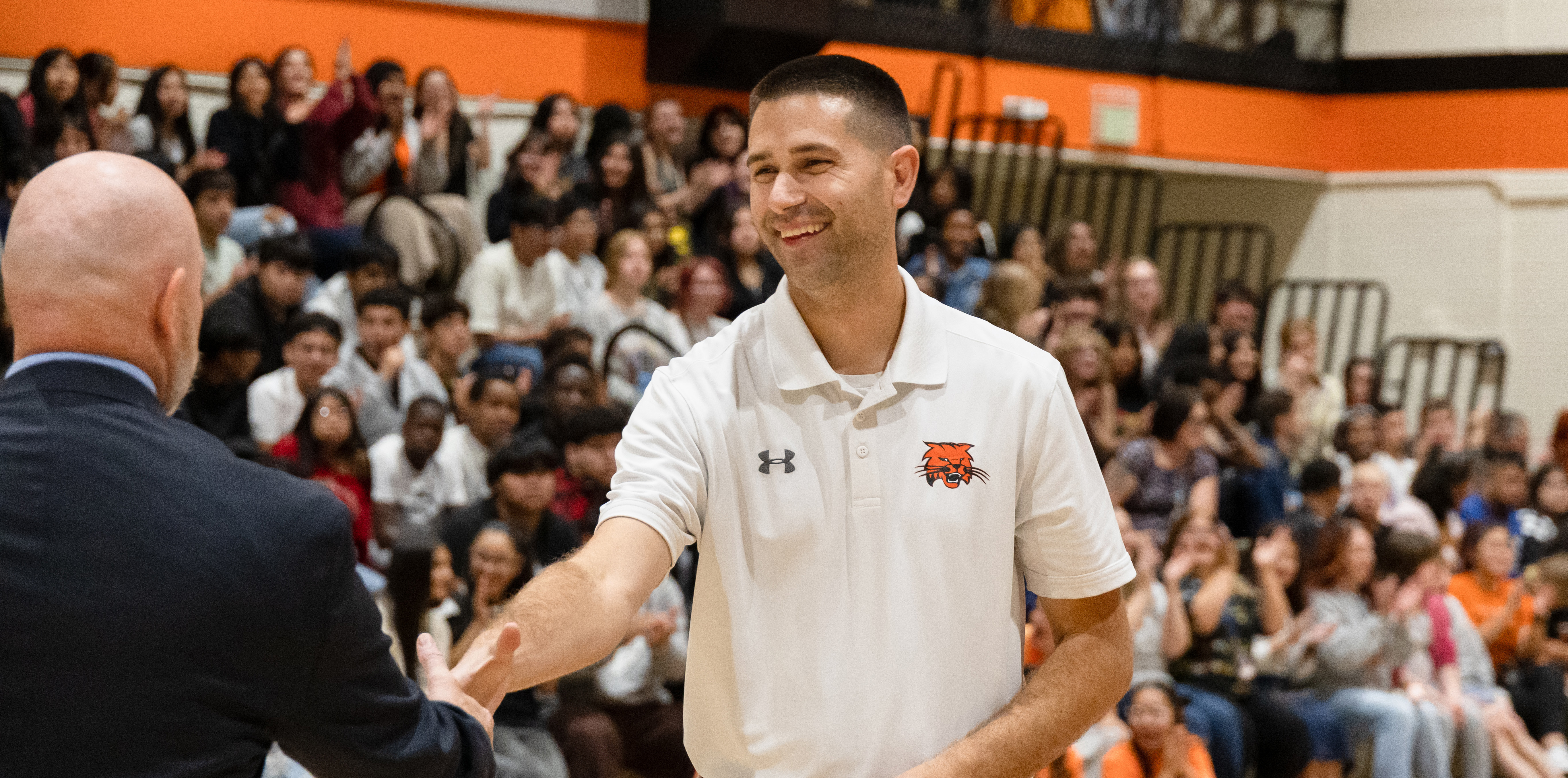 Stephen Paulson shaking a hand with a man