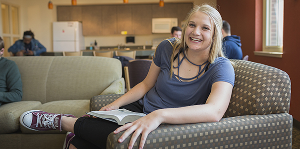 smiling student in residence hall