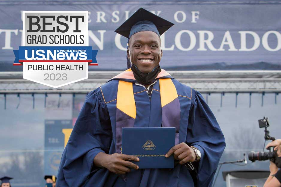 Colorado School of Public Health student Fisayo Awolaja accepting graduation certificate. Best Grad Schools 2023 US News logo in top left corner of image. 