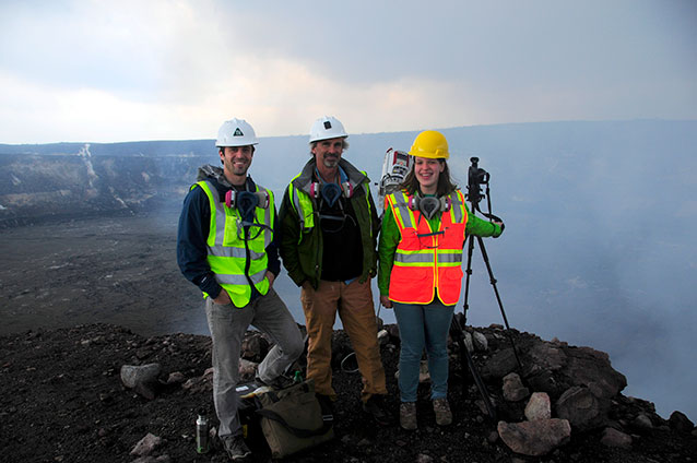 EAS graduate students Adam LeWinter (left) and Amy Burzynski (right) with their advisor Steve Anderson (middle) at the active lava lake at Kilauea volcano