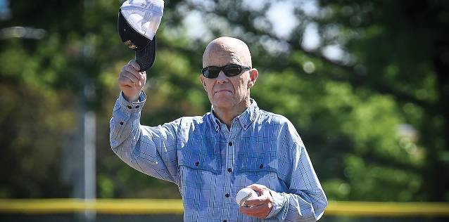 John Haefeli tips his hat to a crowd