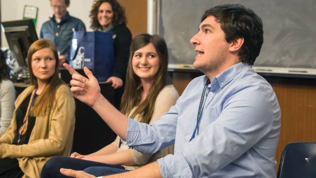 Austin Rogers speaking in a high school classroom during the 2016 Future Teacher Conference